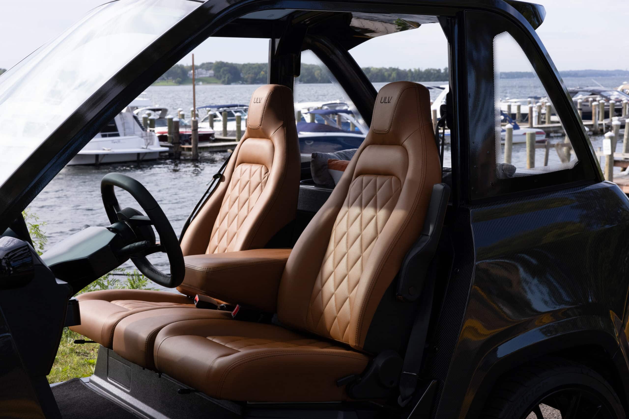 View of a ULV 322 in black from the drivers side showing the brown leather interior