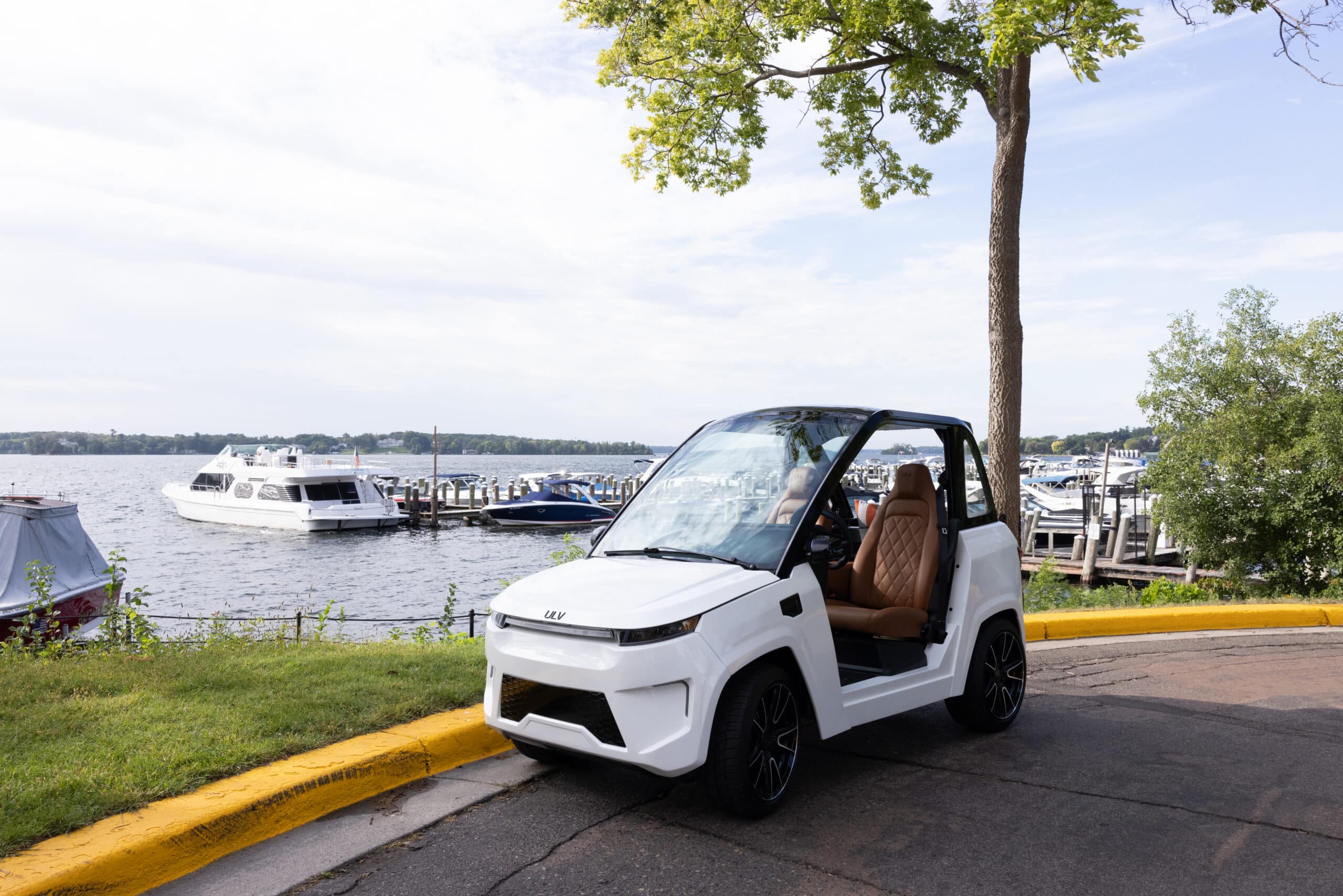 ULV 322 in white parked in front of a marina