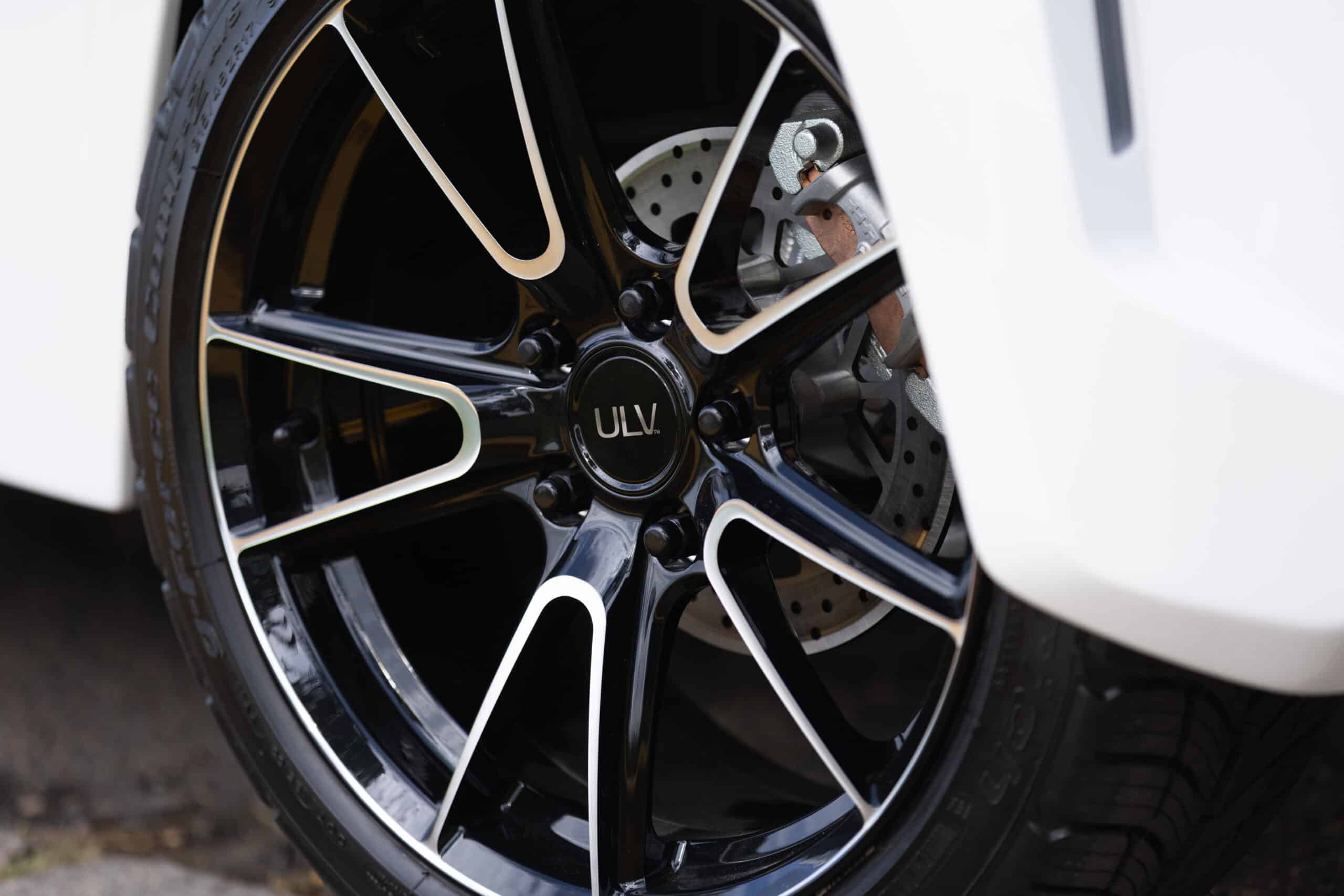 Close up view of white ULV 322 rim and tire