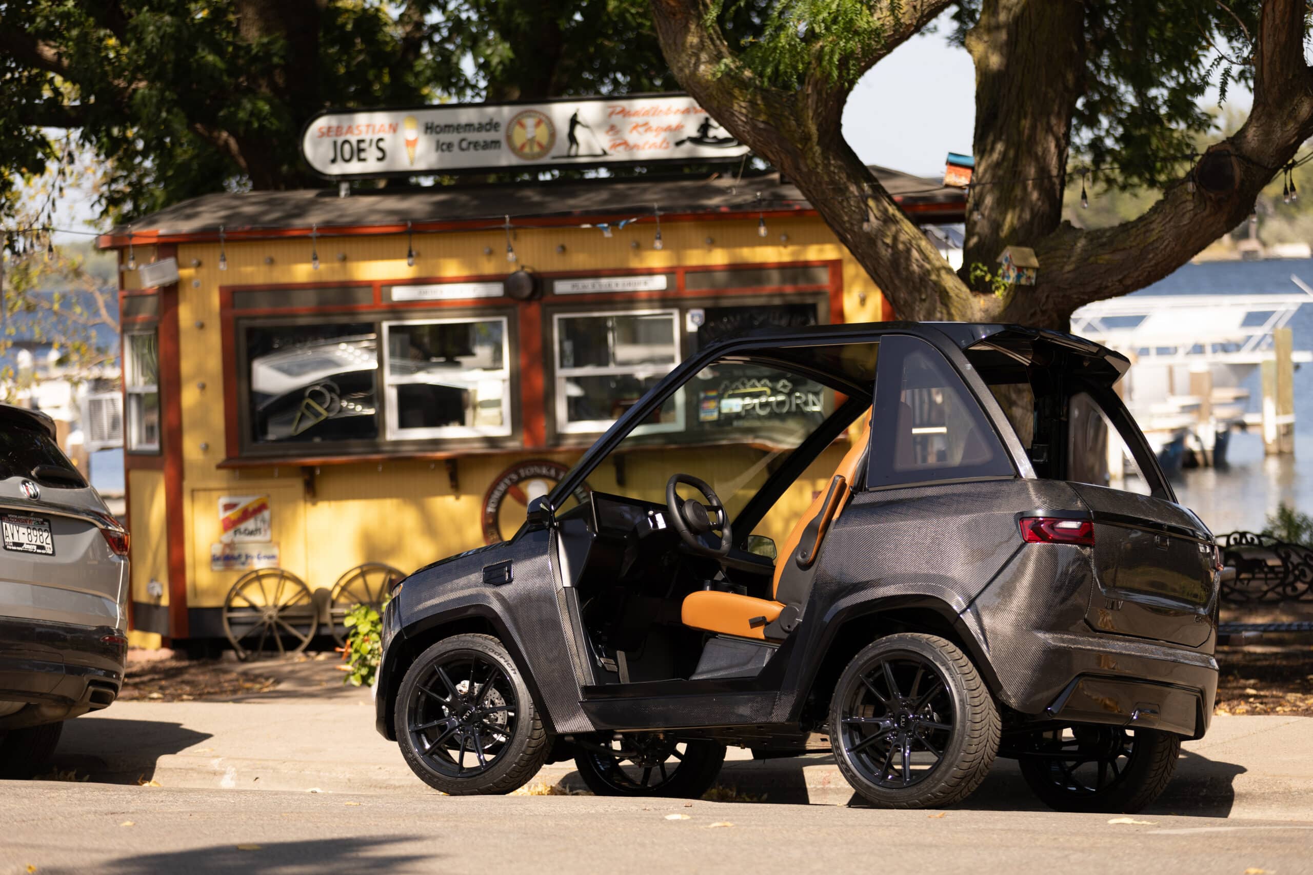 ULV 322 carbon in black parked at the curb in front of ice cream shop