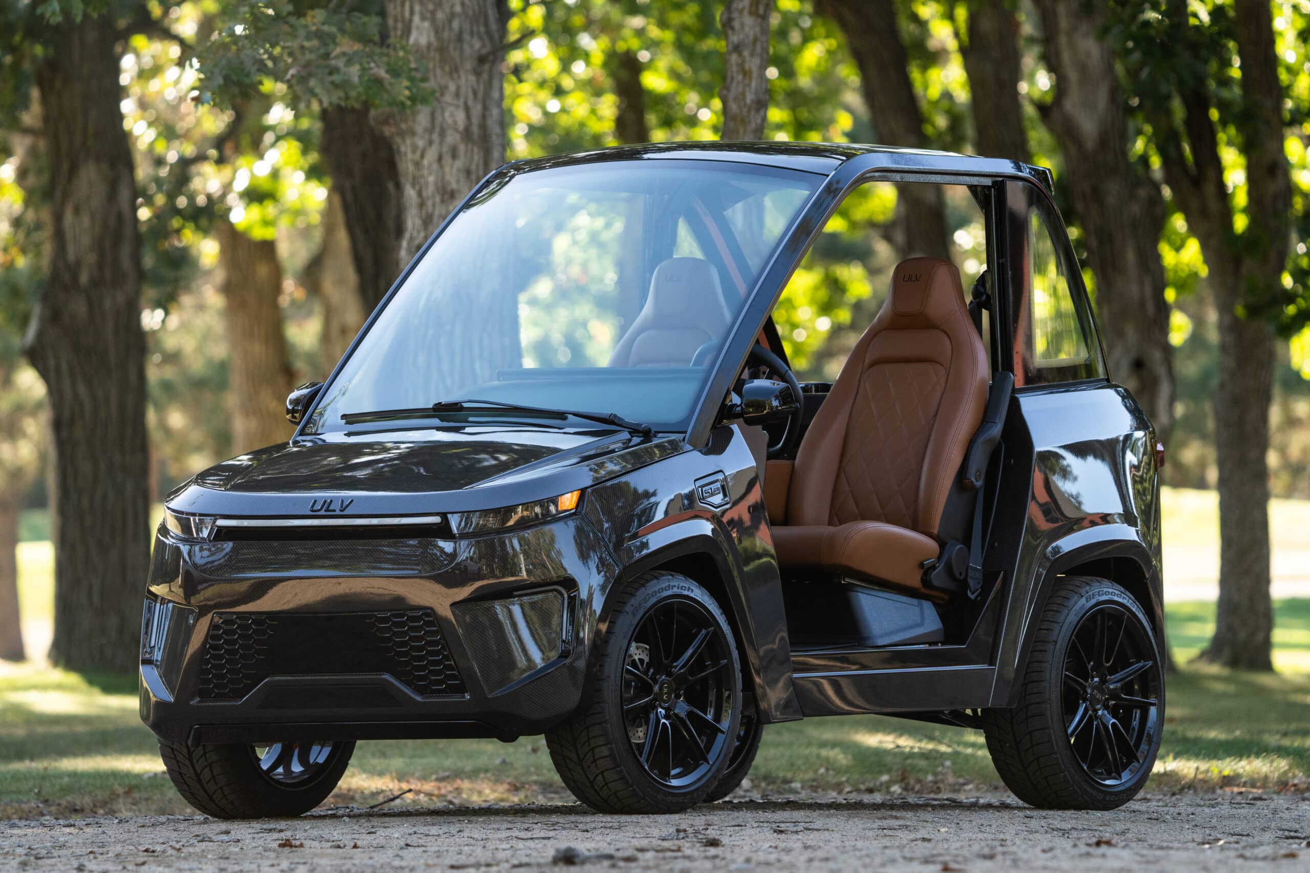 ULV 322 in black parked on a trail surrounded by trees